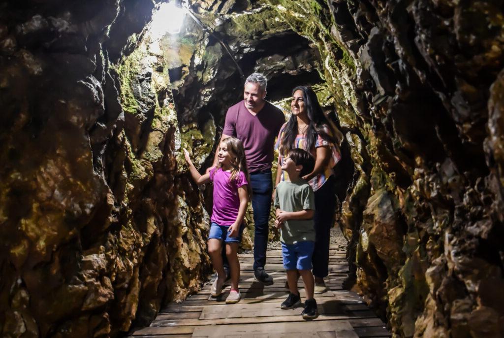 family walking in a tunnel